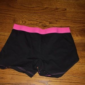 Kids spandex shorts. Black with bright pink waist